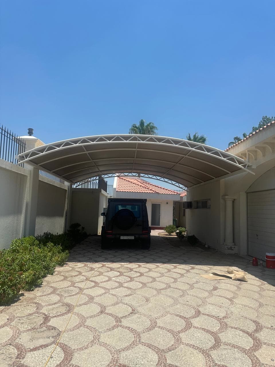 Curved steel carport — private residence