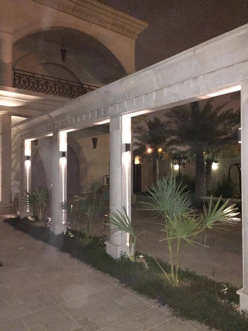 Lit colonnade and pool terrace — private residence